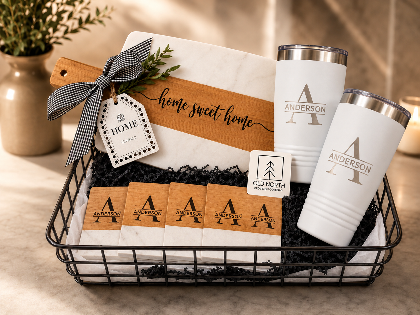 Personalized Home Sweet Home Gift Basket with marble serving board, white tumblers, and engraved coasters
